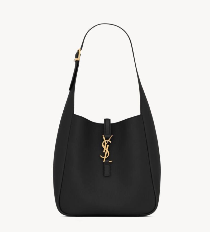 Black handbag with a gold logo on a white background